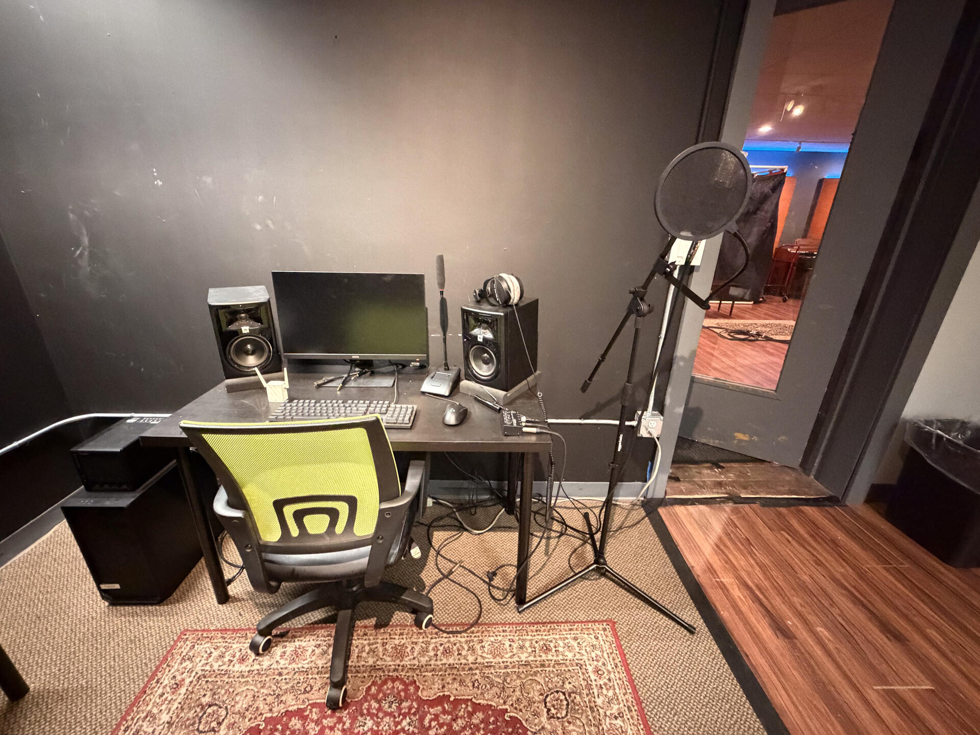 Isolated recording booth with monitors and mic