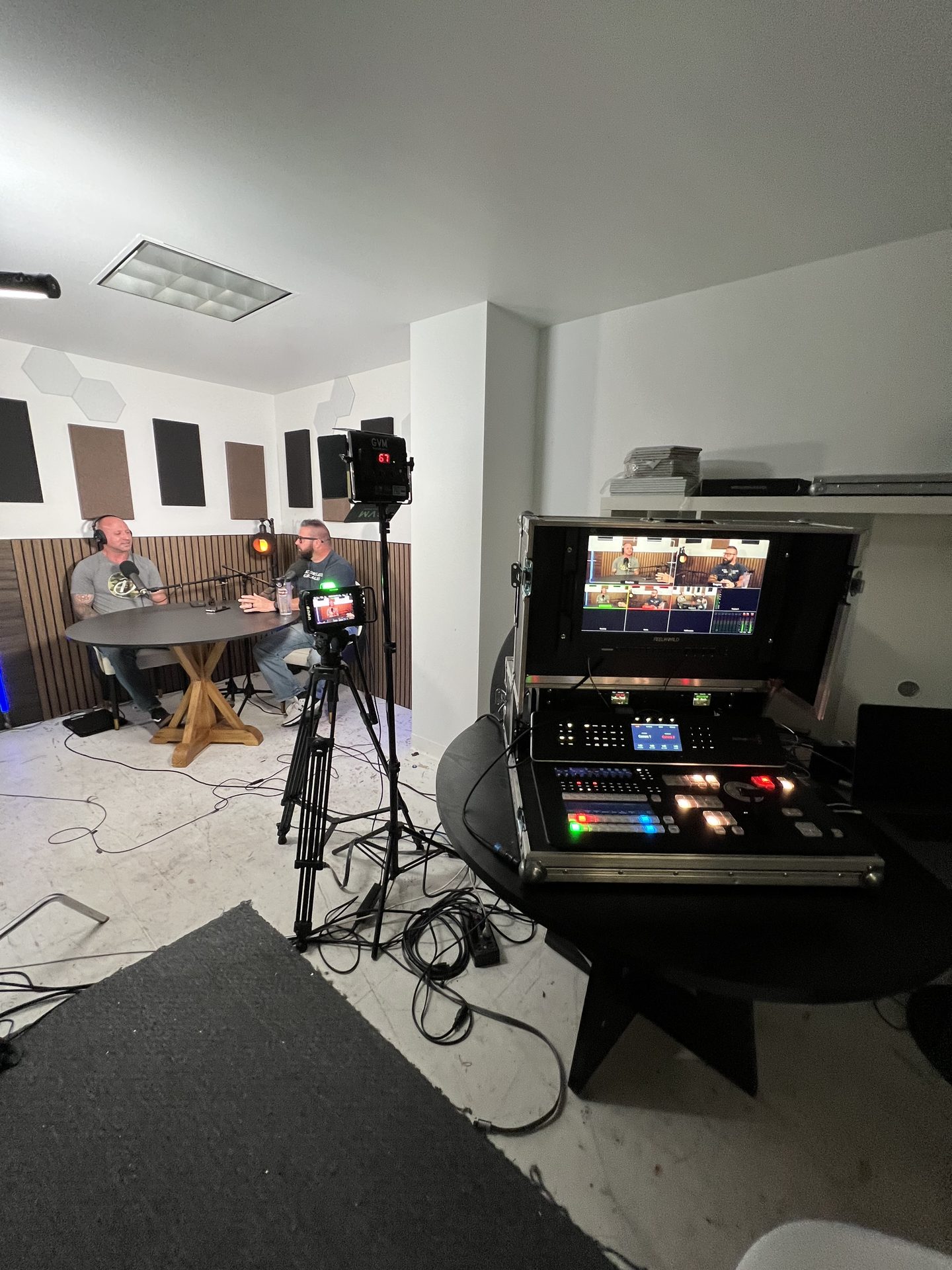Second podcast space with production control station and multi-camera monitoring